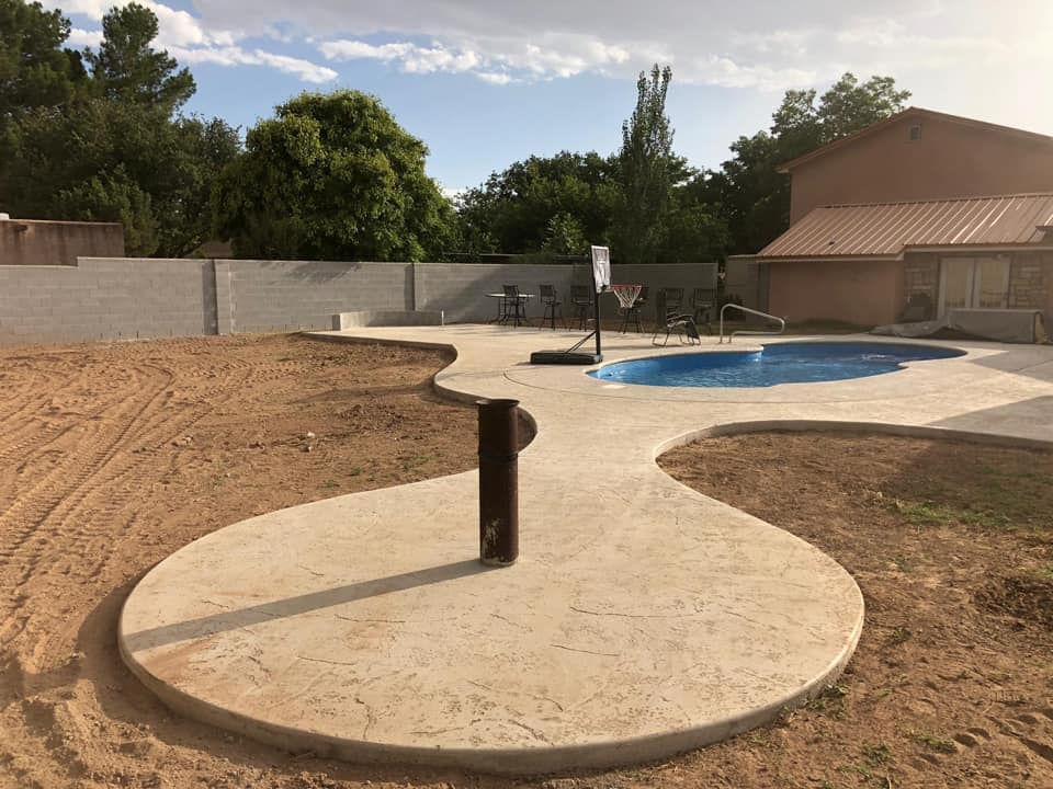 This concrete patio we installed has a red tint that makes it stand out!