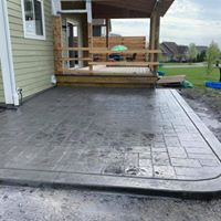 gray accent concrete patio we installed in Elk Grove