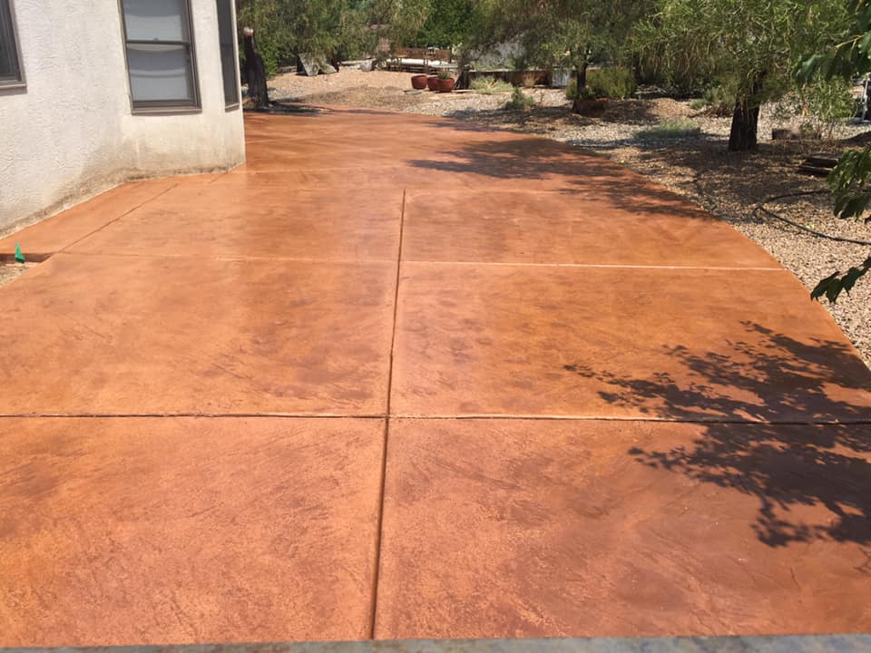 Terra cotta colored and stamped concrete patio we poured in Elk Grove