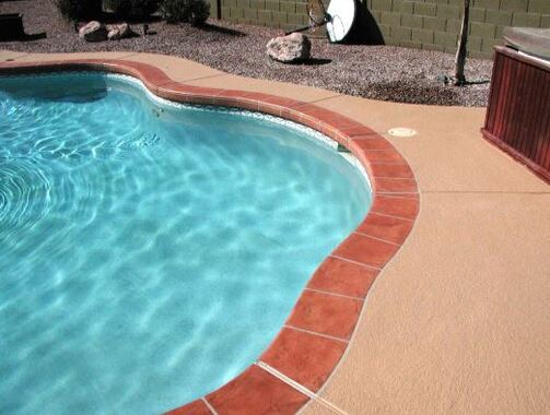 refinished pool deck with brick outline in Elk Grove